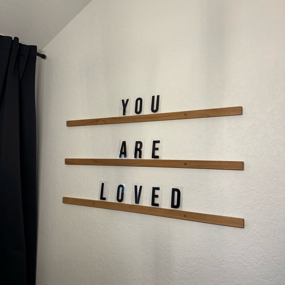 Letter ledges with black letters